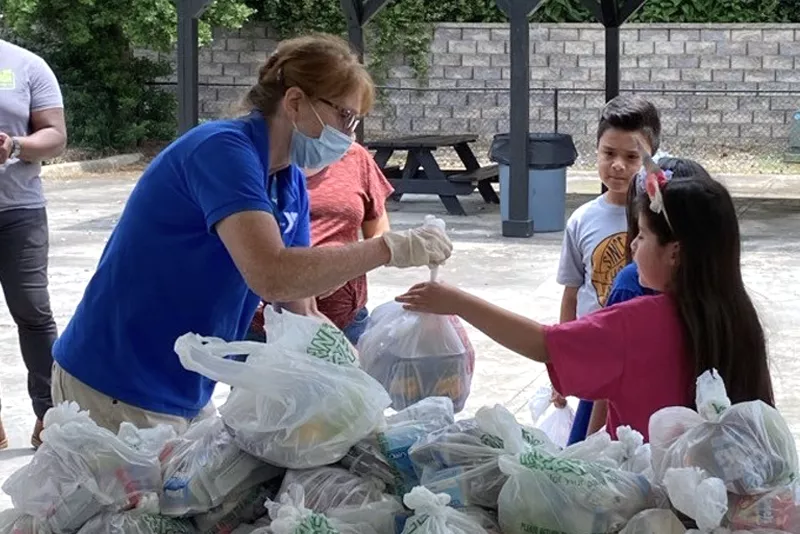 Woman handing out food